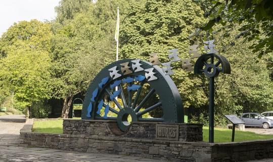Industrial water wheel sculpture at Burrs park.