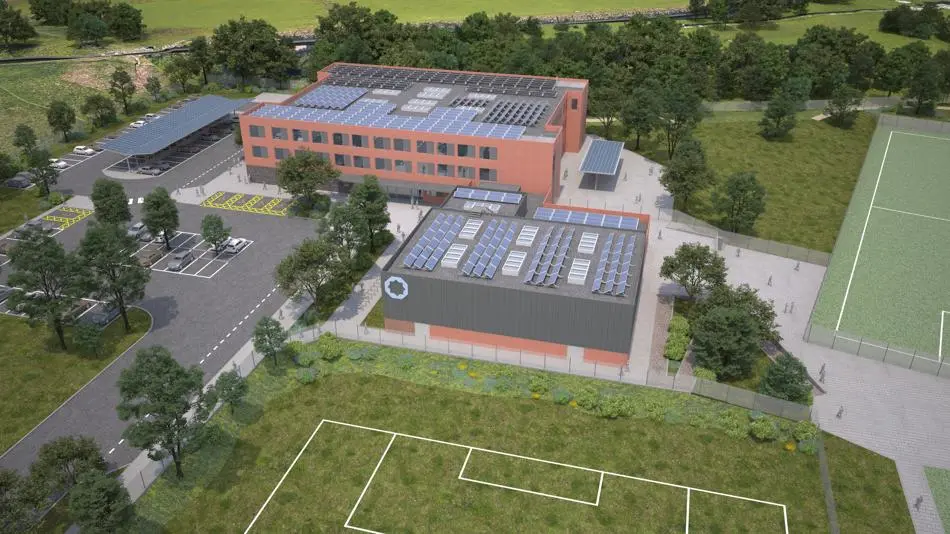 Computer generated image of an aerial view of a school building and sports pitches surrounded by grass and trees