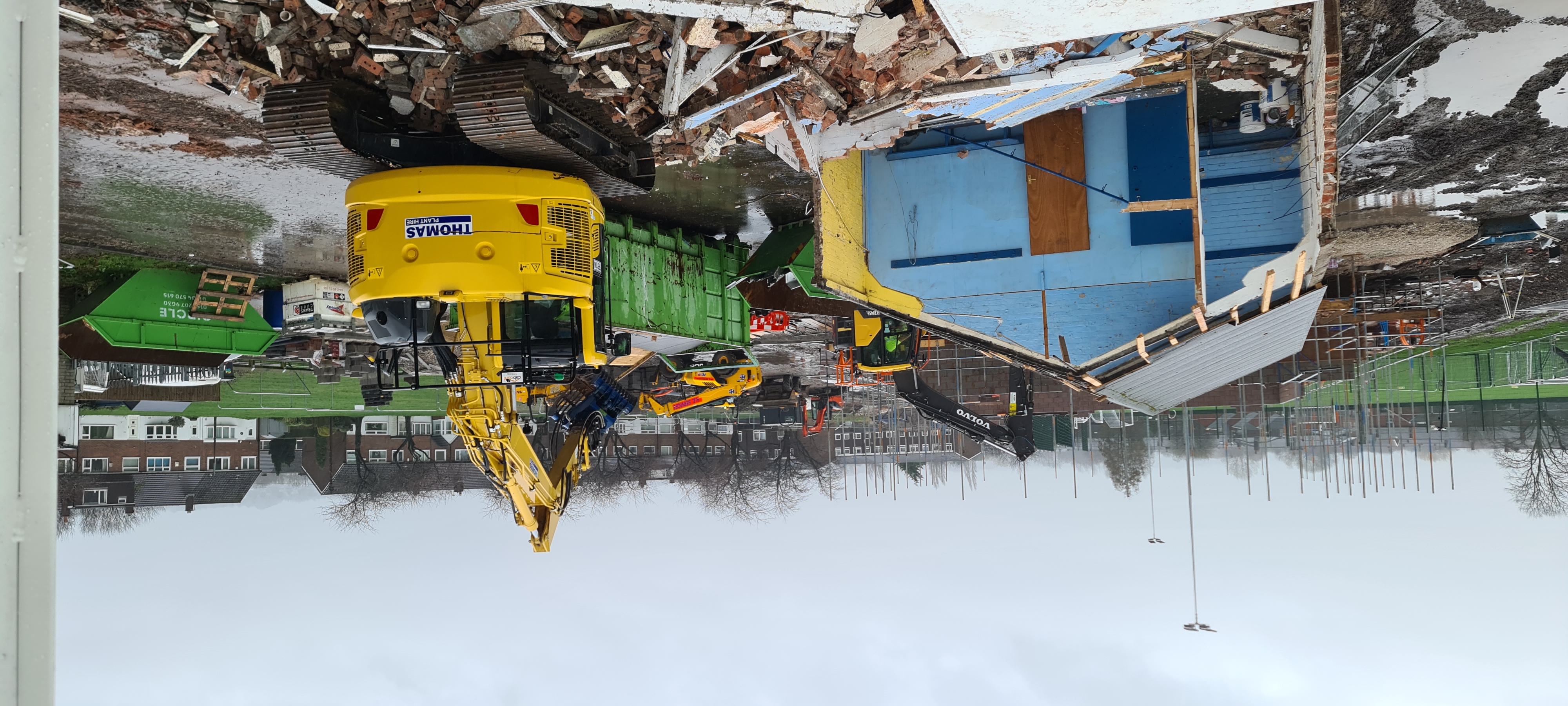 Bulldozer demolishing an old building