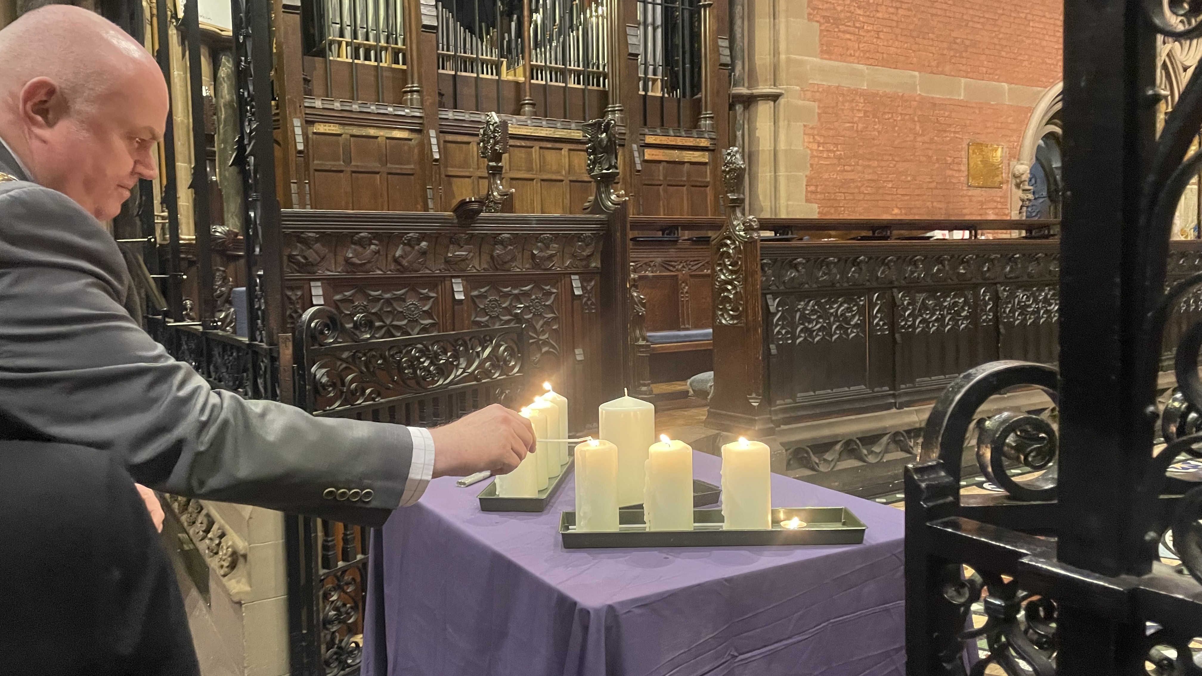 The Mayor lights a memorial candle