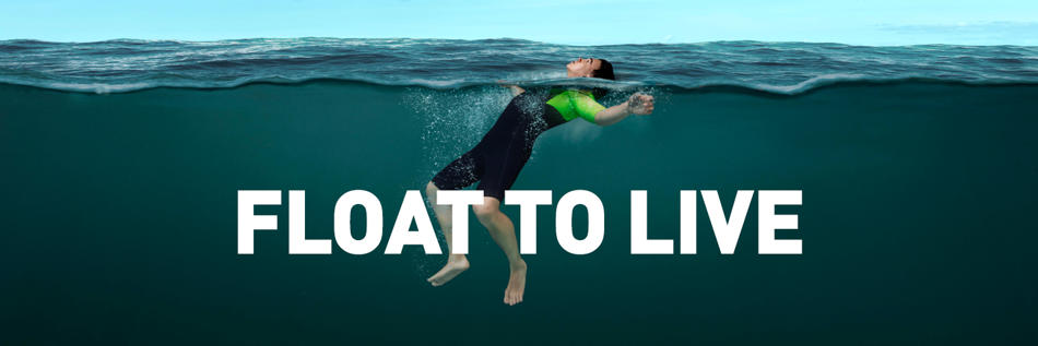 Person floating in open water