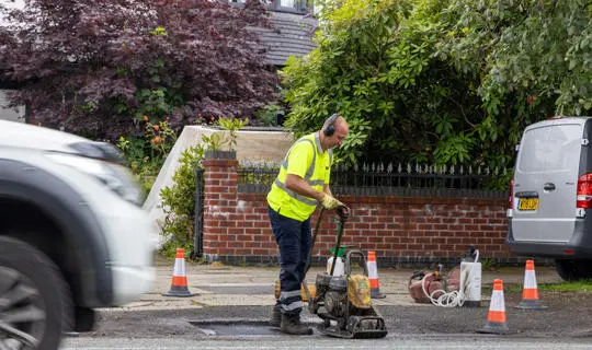 Compacting Pothole Using Compactor Pothole repairs - Bury Council