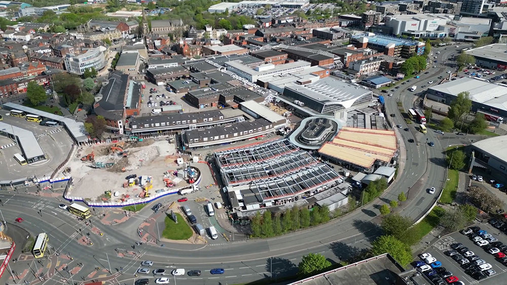 Aerial view of a town centre surrounded by roads