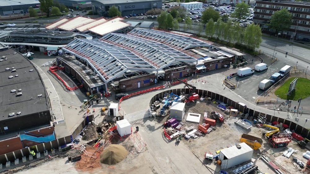 A construction site and a steel structure covering a large open market