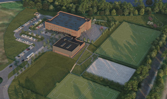 Computer generated image of an aerial view of a school building and sports pitches surrounded by grass and trees 
