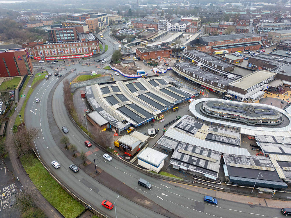 Aerial view of a town centre surrounded by roads