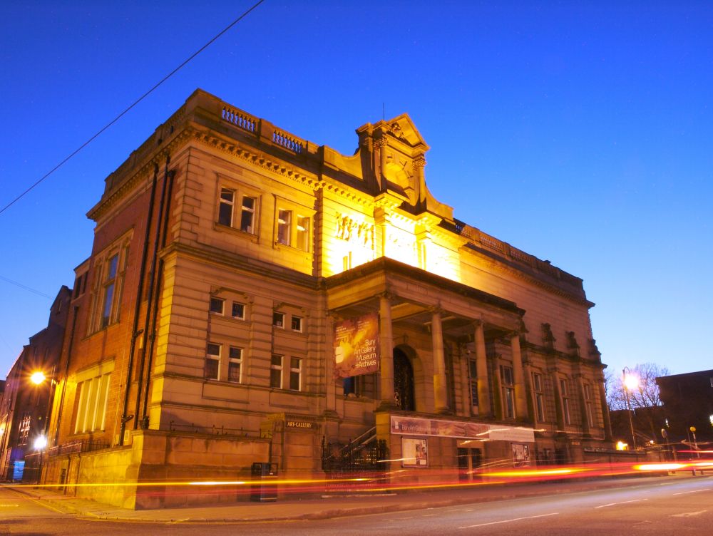 Large stone building lit up at night