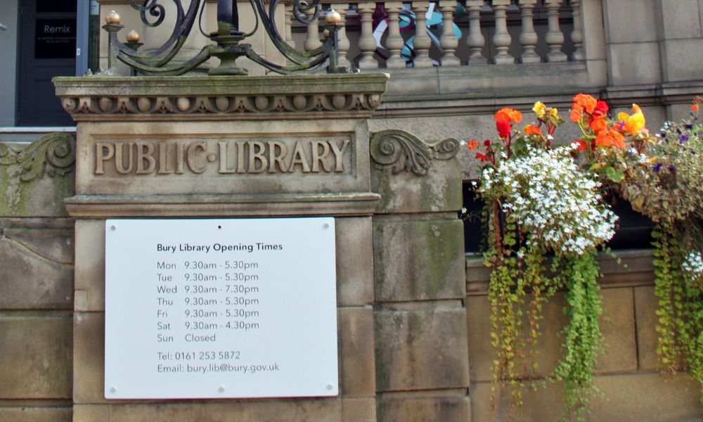 Bury Library opening times sign at Bury Library