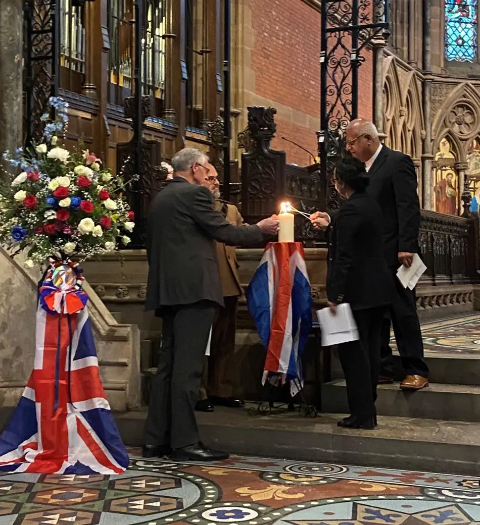 Lighting of memorial candle during the VE 80 Service in May