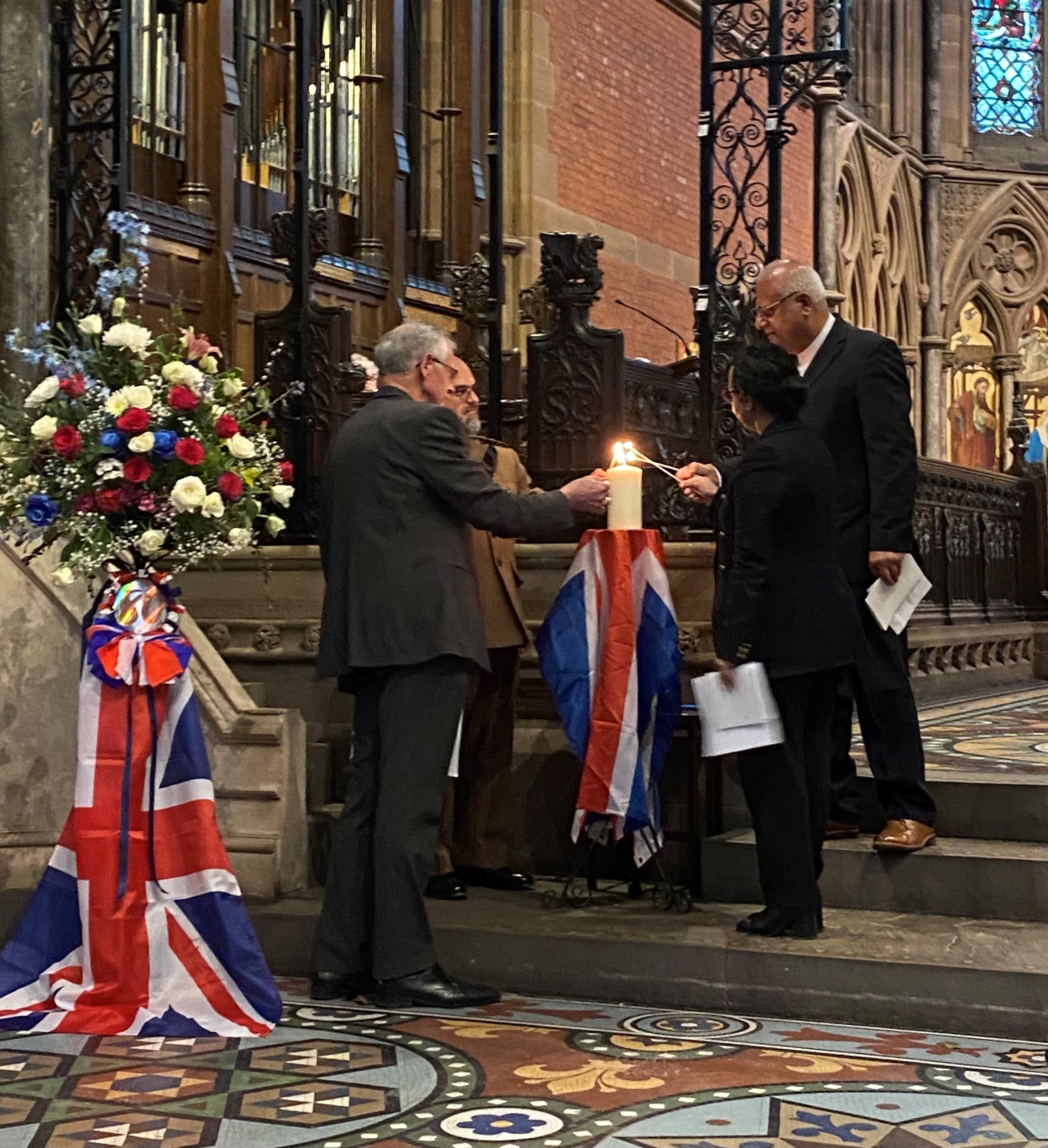 Memorial candle lighting at the VE Day 80th Anniversary Service
