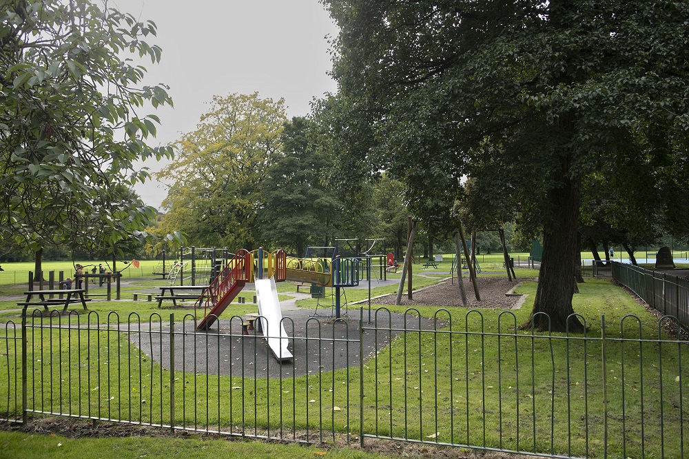 Slide and swings in a play area.