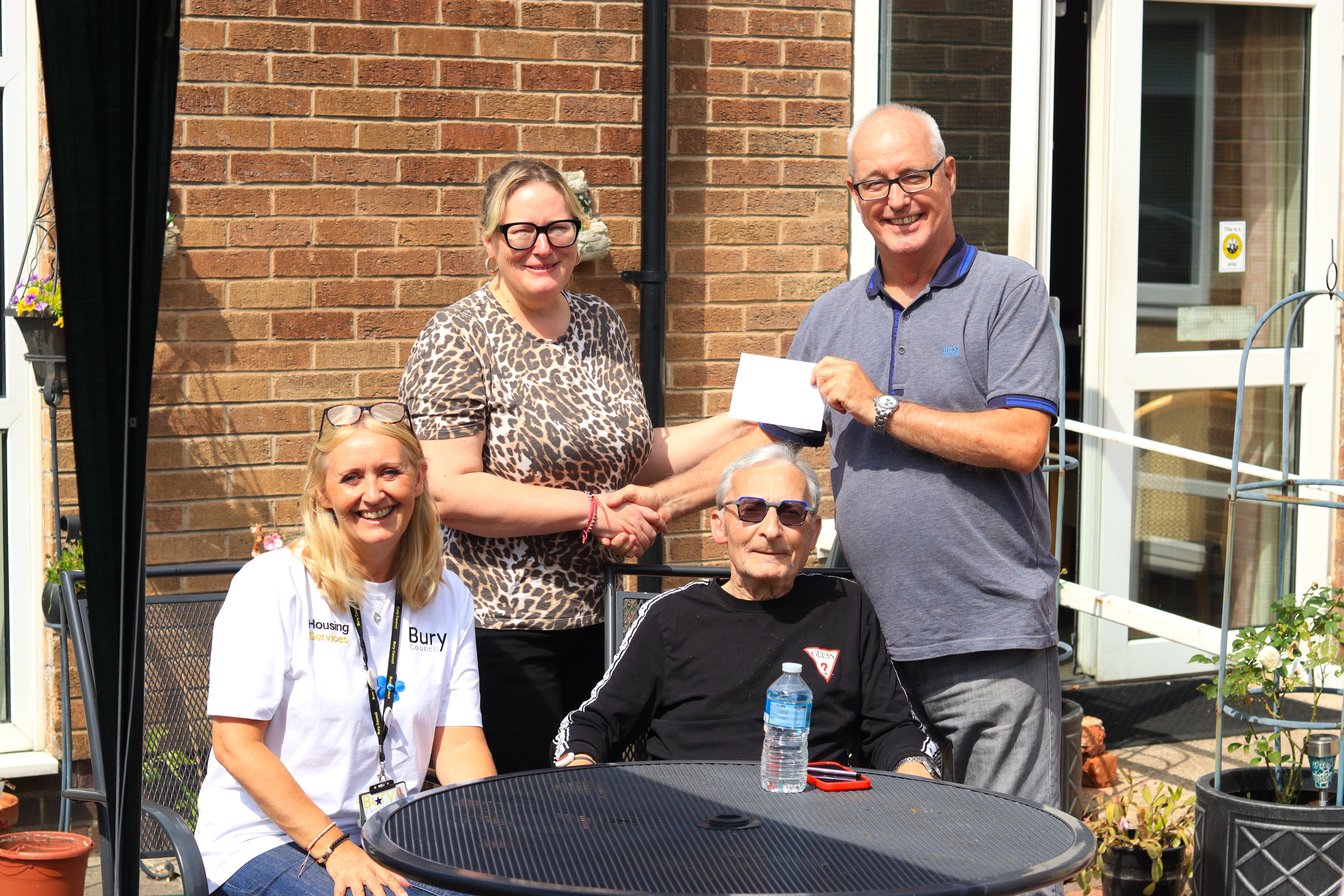 Staff with garden competition winners