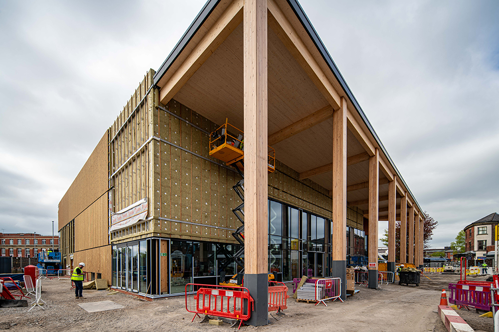 Cladding being installed on a large building