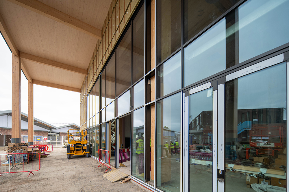 Full length windows on the the front of a large building