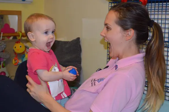 adult making eye contact with child