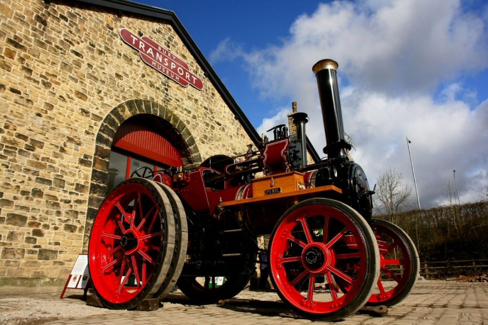 A steam engine in a courtyard.