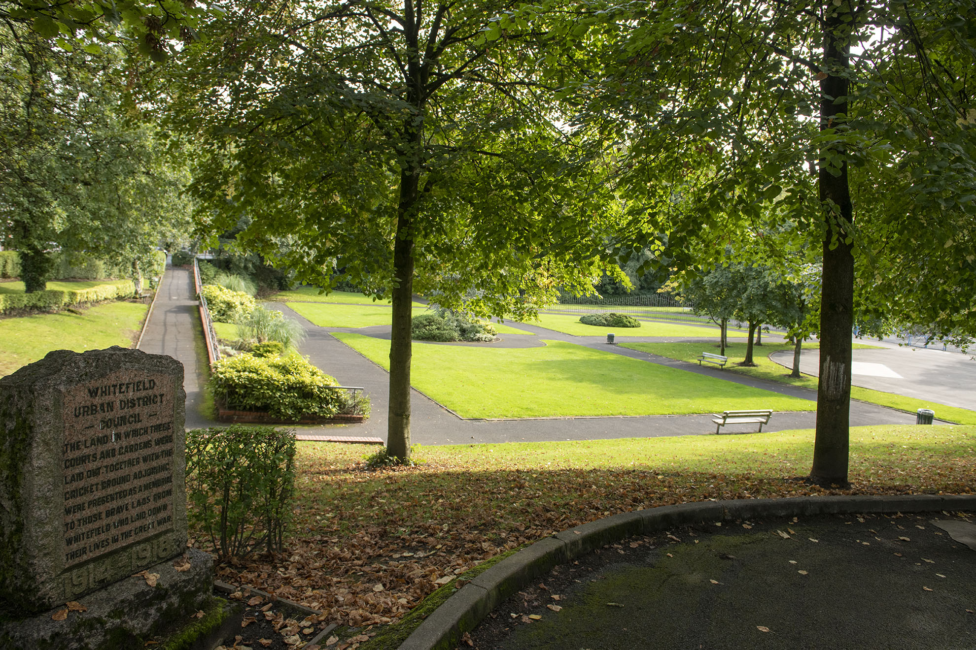 Memorial stone overlooking main garden area at Hamilton Road Park.