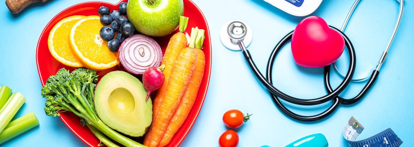 fruit and vegetables on a heart shaped plate