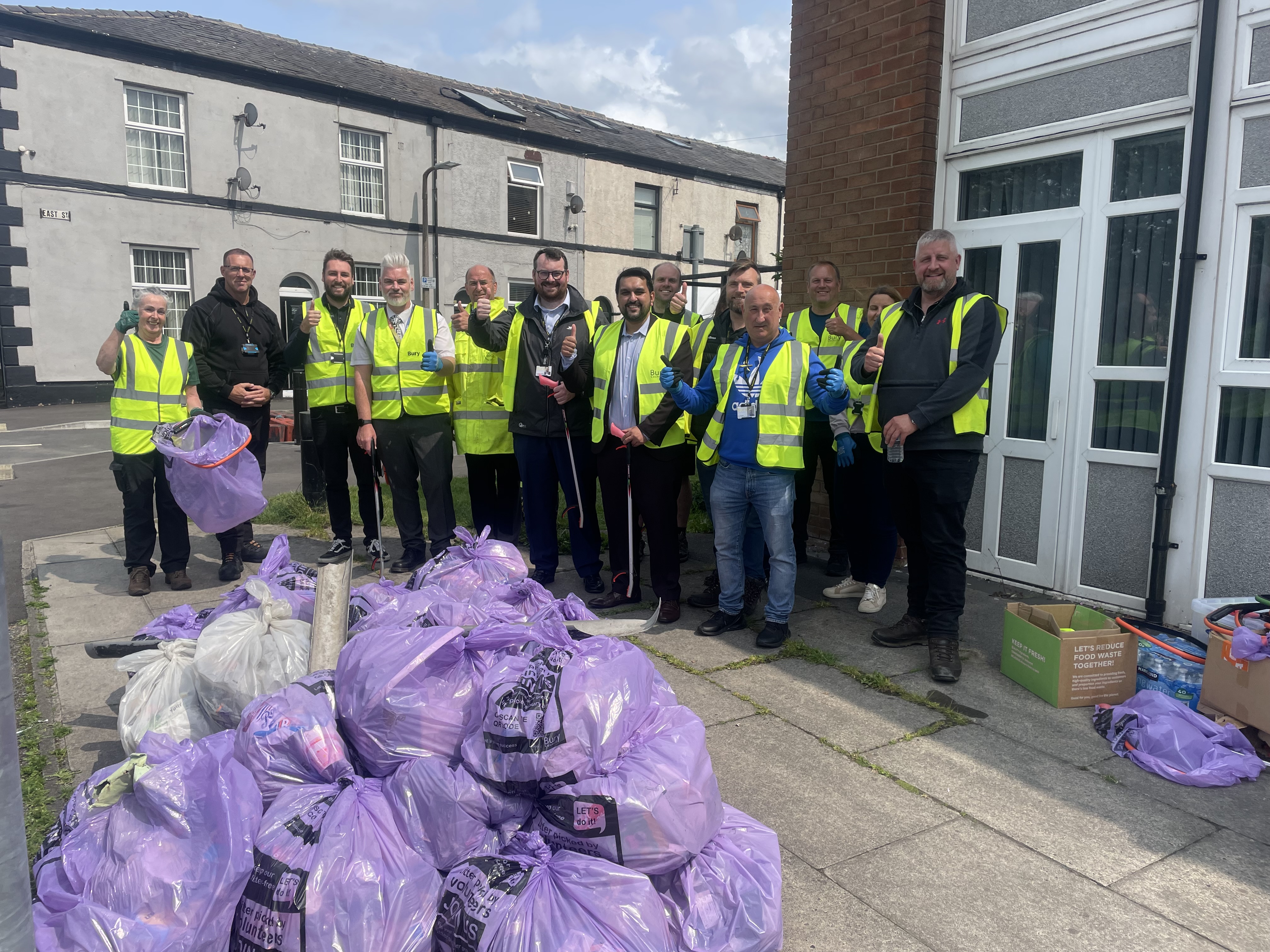 People with full rubbish bags