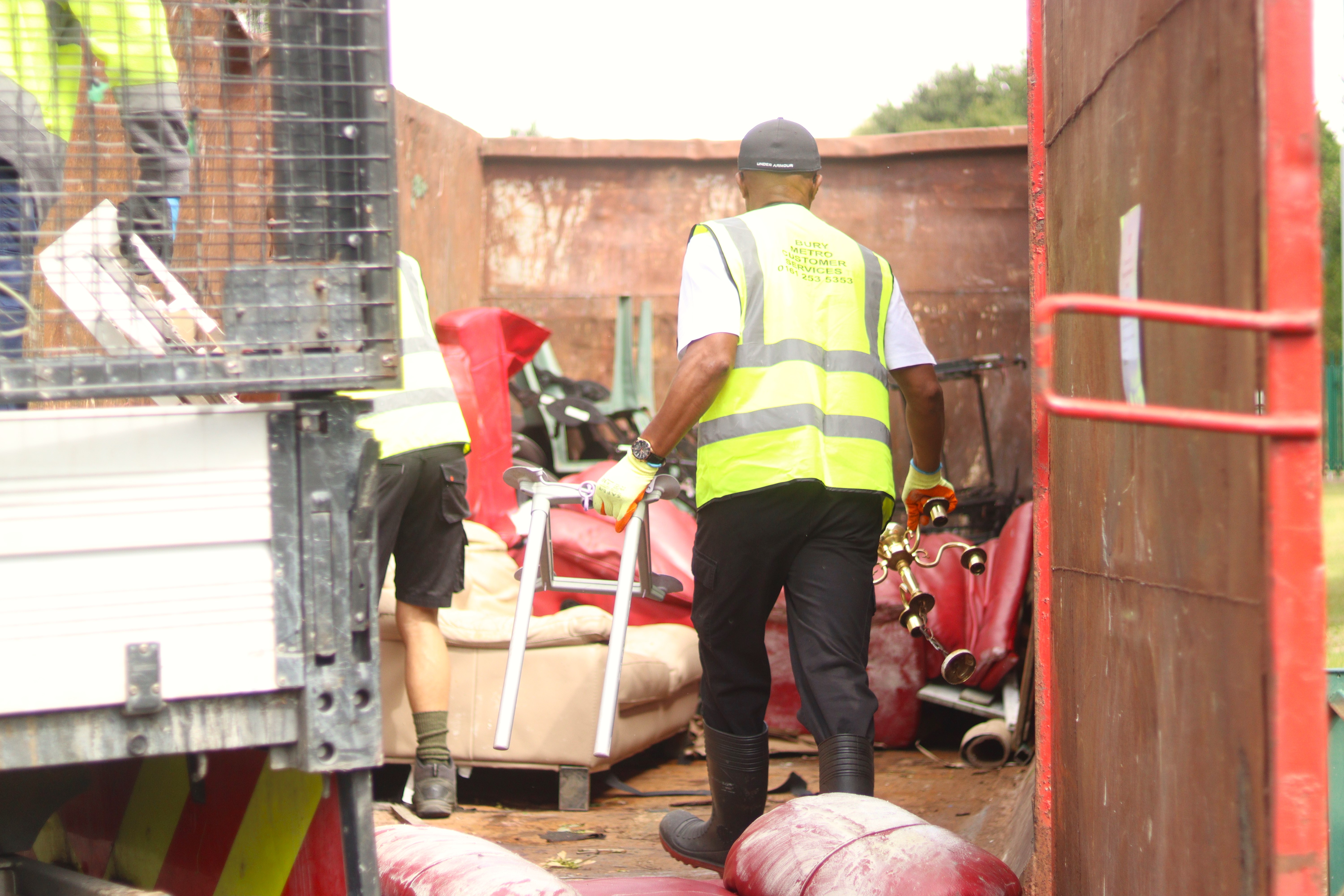 staff filling the skip