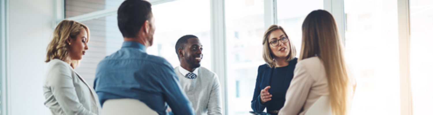 a group of adults having a conversation
