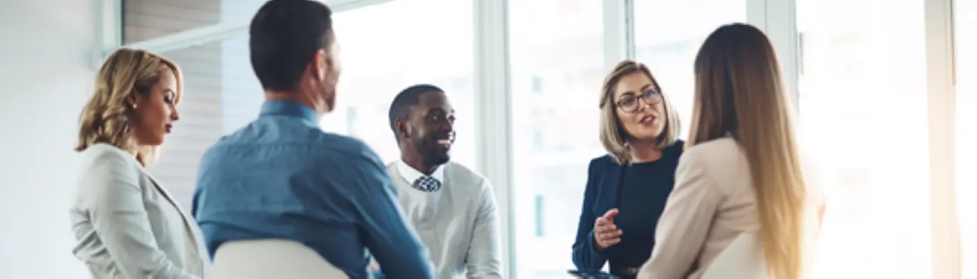 a group of adults having a conversation