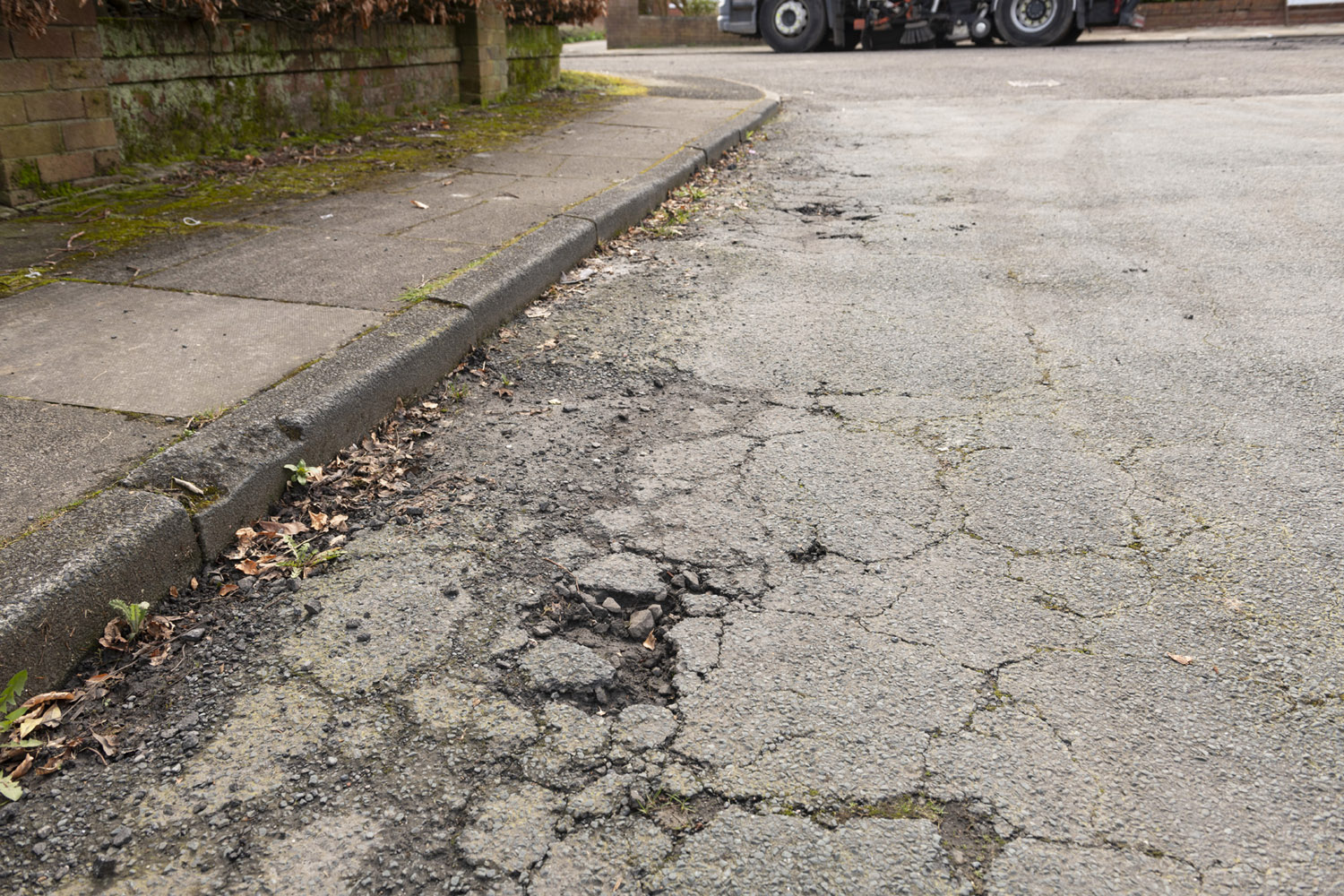 A road that has a damaged road surface
