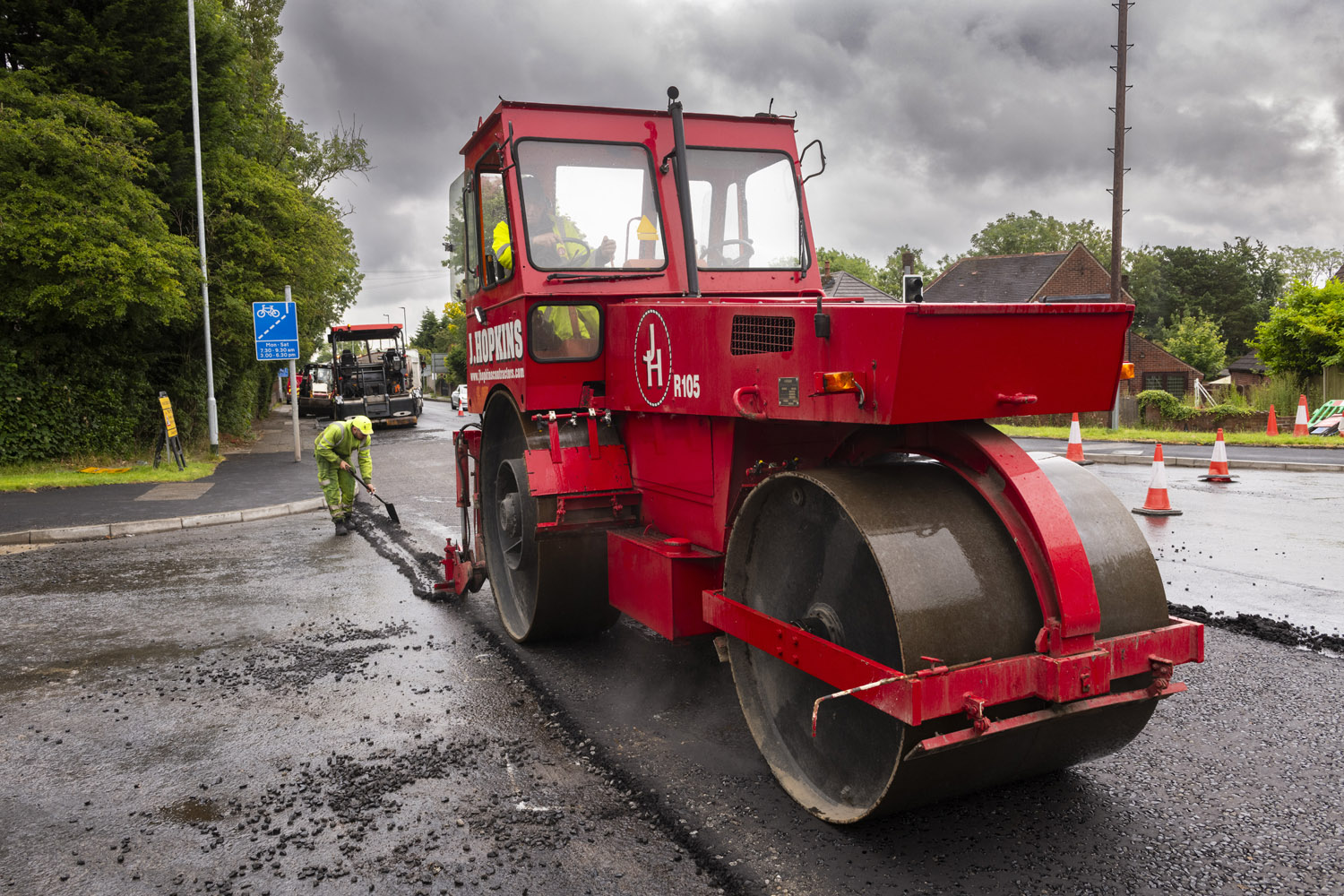 A red rolling machine on a road surface