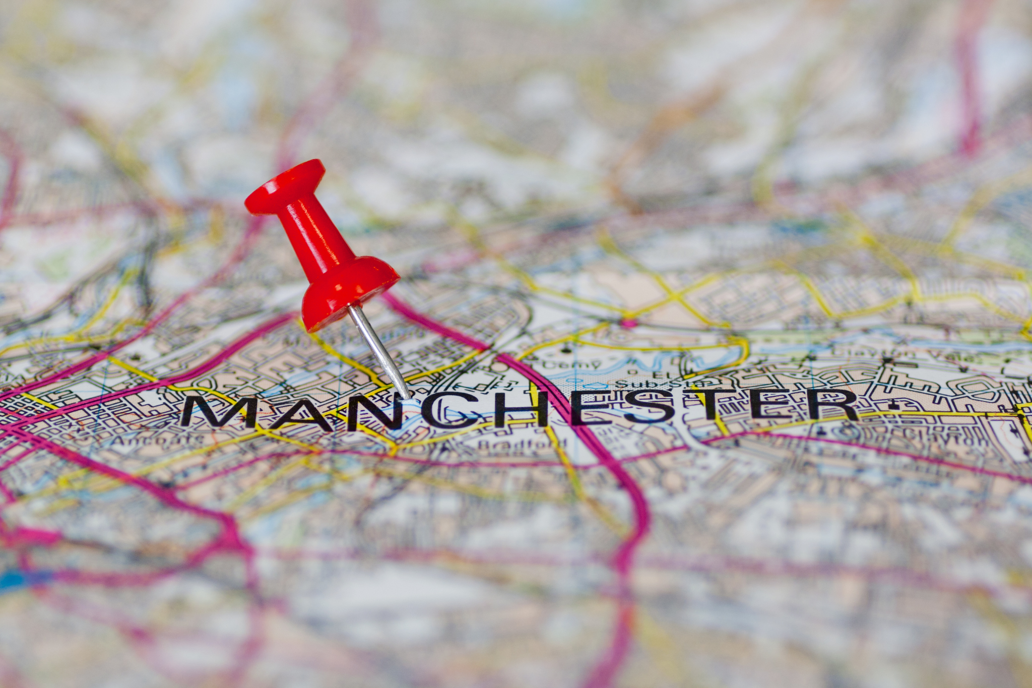 Map of manchester with a drawing pin
