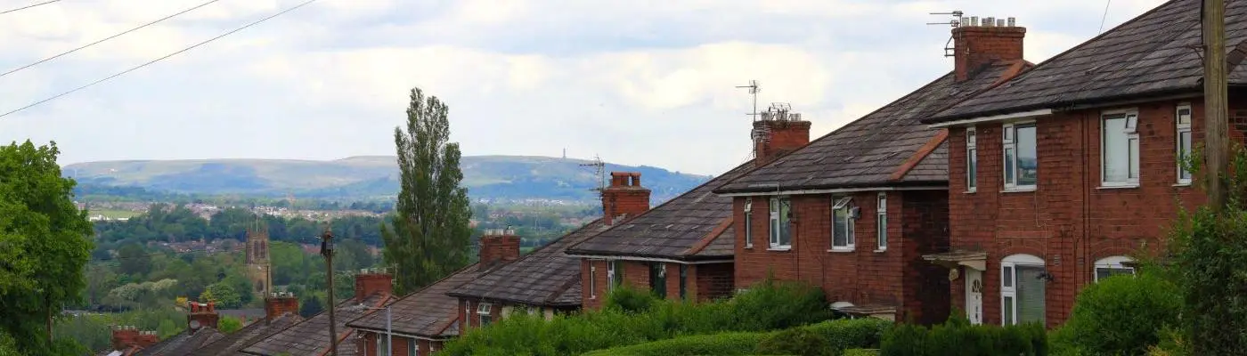 Row of house with a view to Holcombe Hill