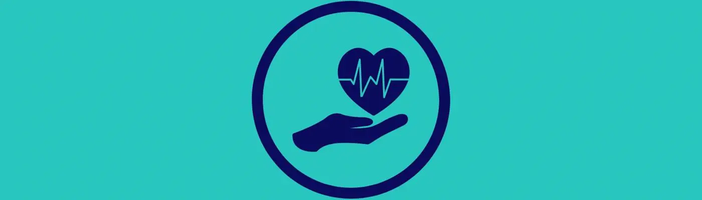 A hand holding a heart with a life line