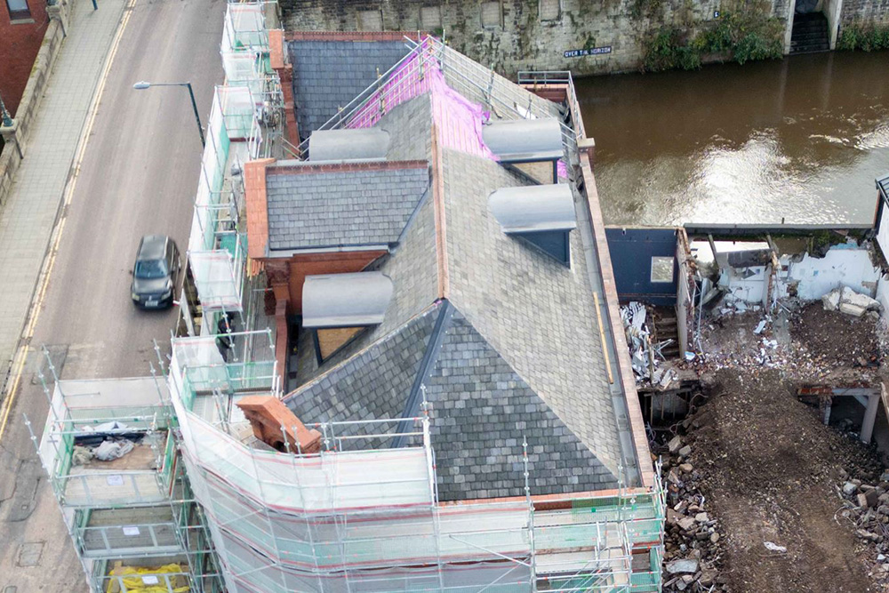 Ariel view of a building with a grey slate roof