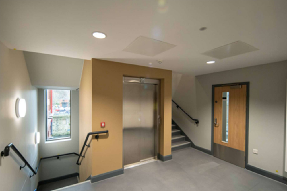 A lift door on a staircase