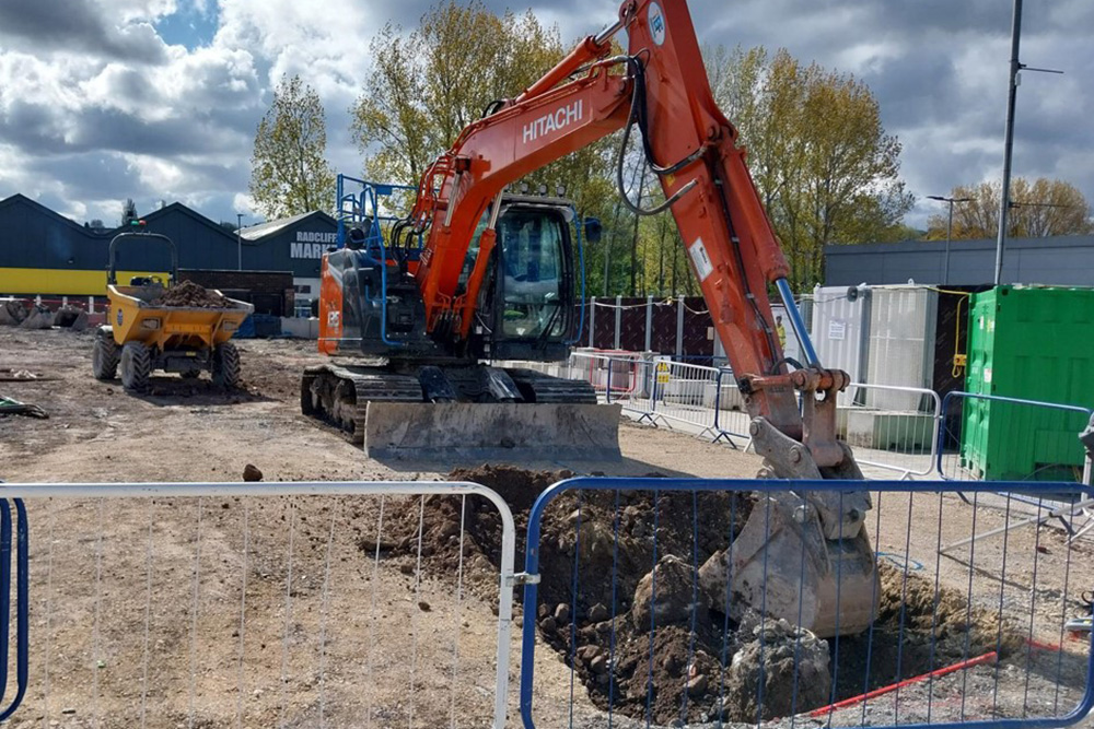 A large machine being used to dig a hole on a construction site