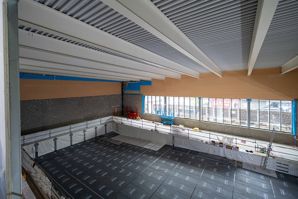 A large indoor swimming pool during construction