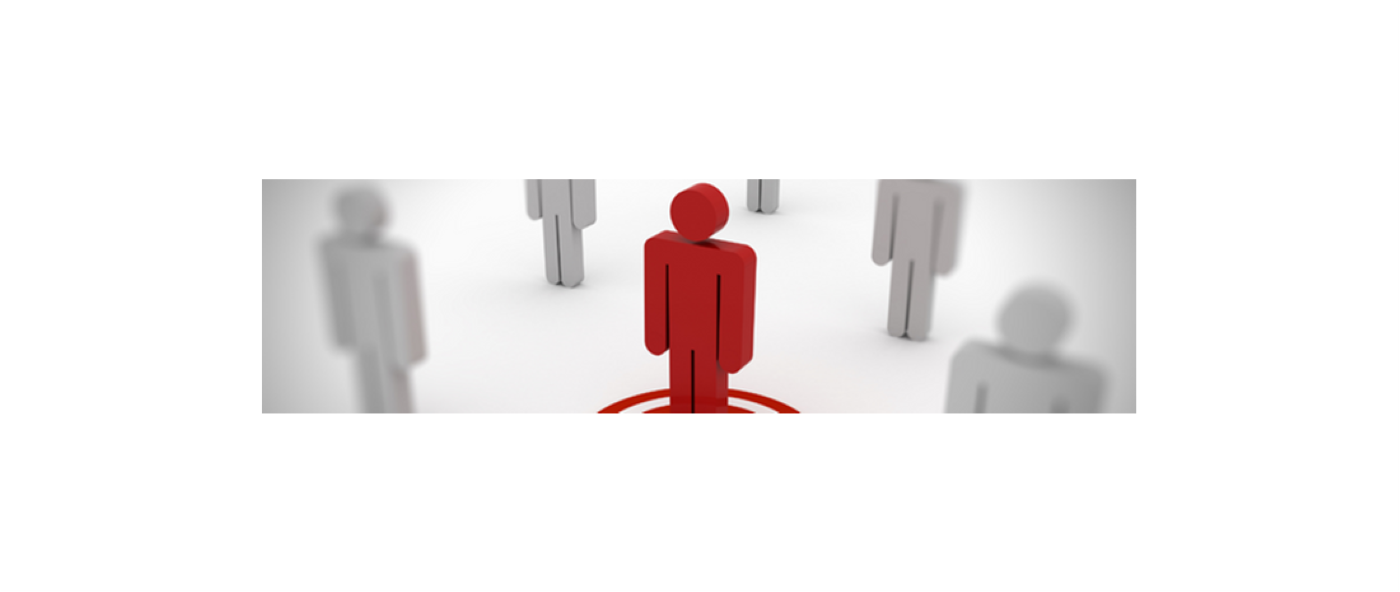 A red figure standing in the centre of numerous grey figures