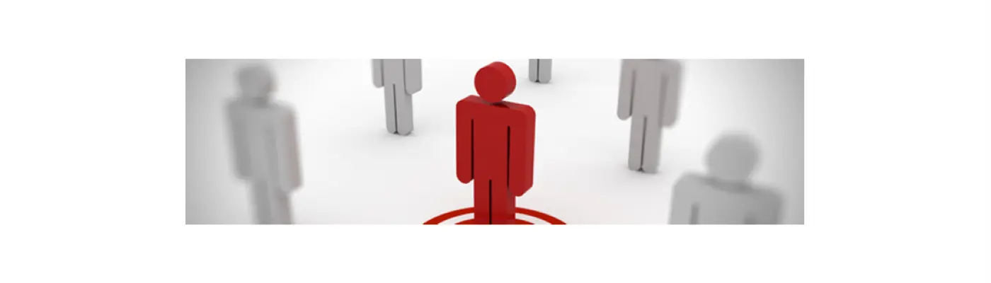 A red figure standing in the centre of numerous grey figures