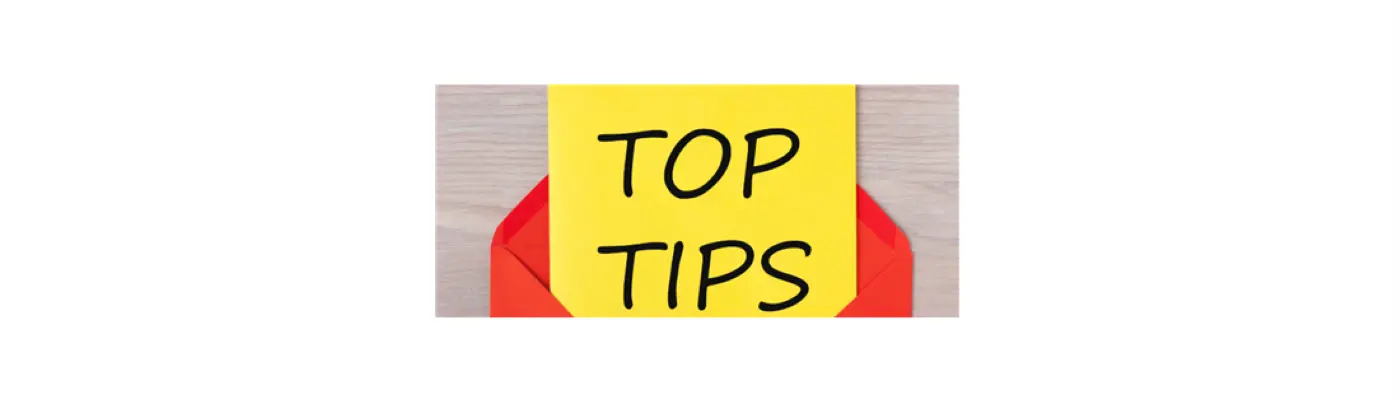 top tips written on a piece of paper sticking out of an envelope