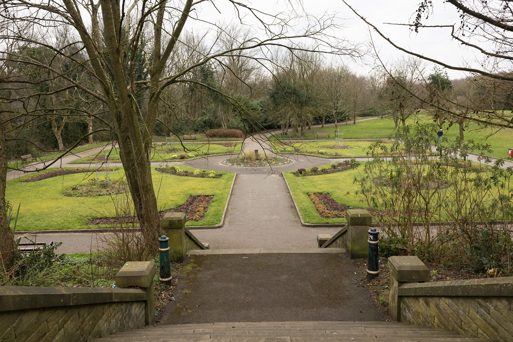 Steps leading to a path and gardens.