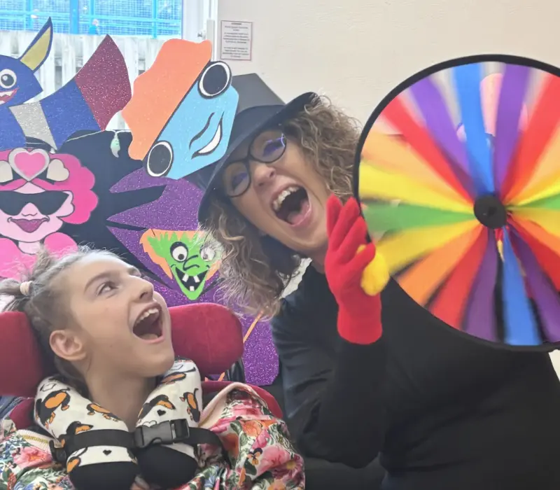 Gwyn with a child at Marvin's storytime show