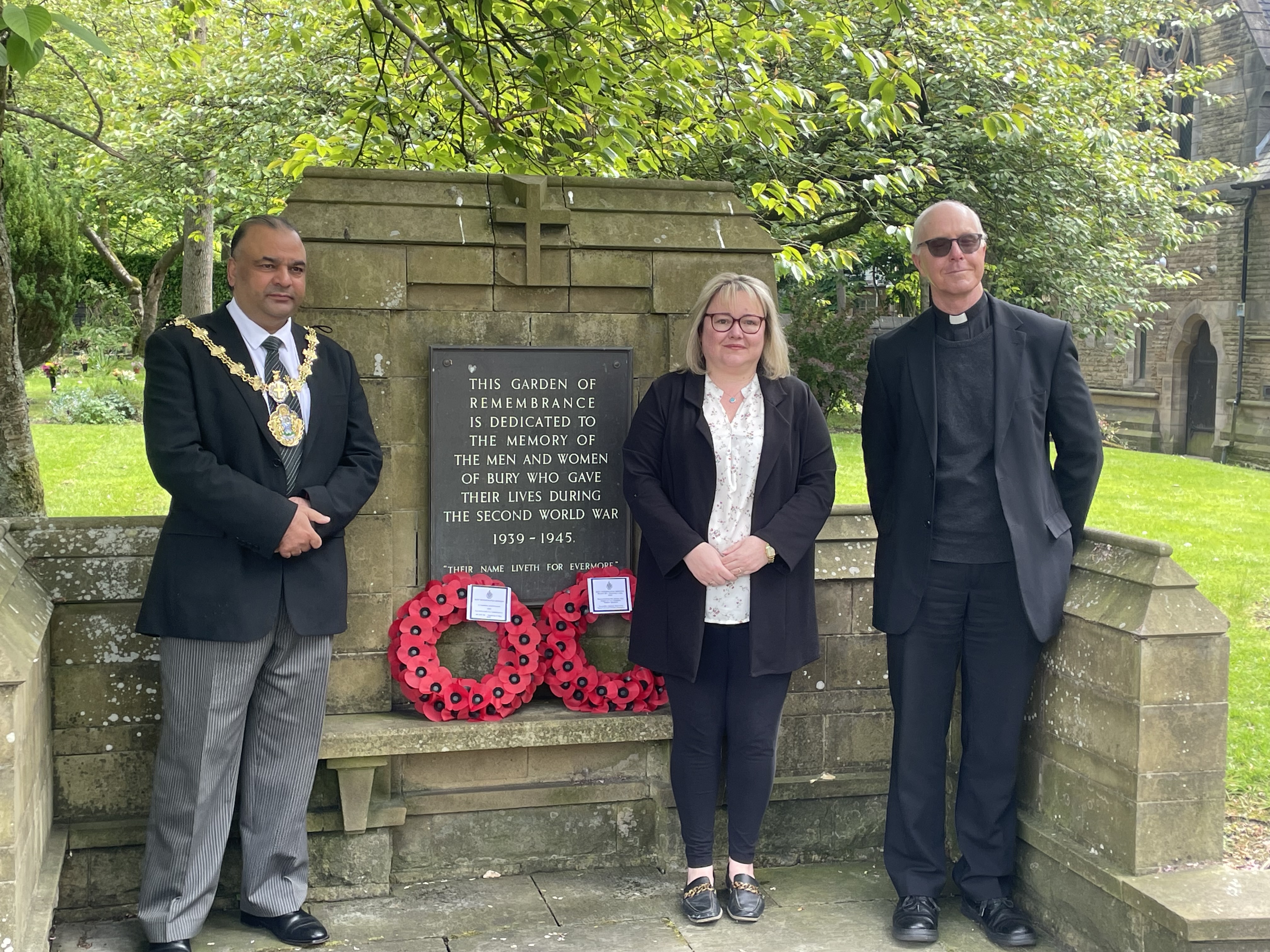 People outside a war memorial