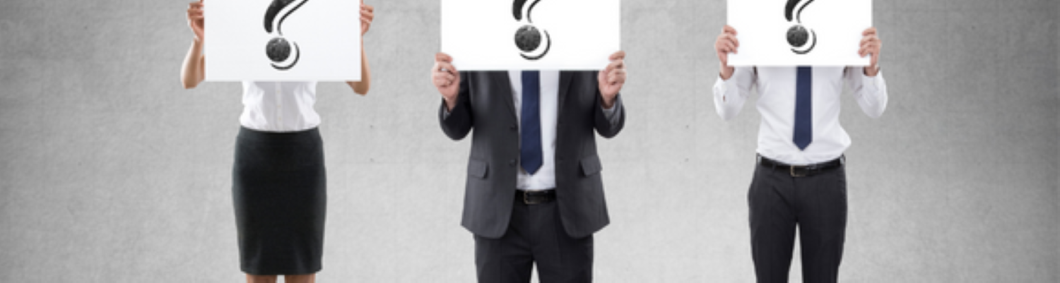 three people holding question marks in front of their faces