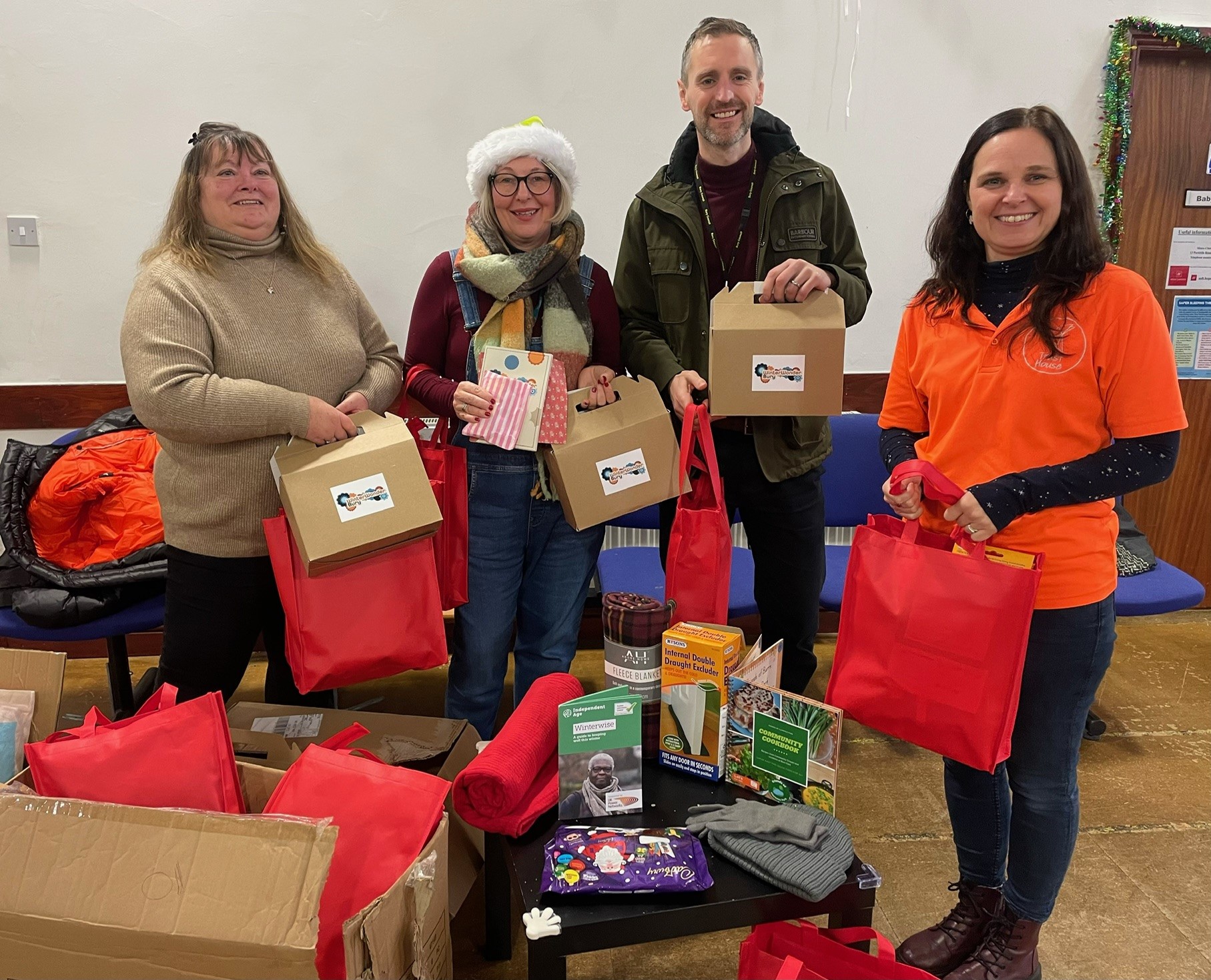 Group of people putting the winter warmer packs together