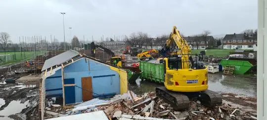 Bulldozer demolishing an old building