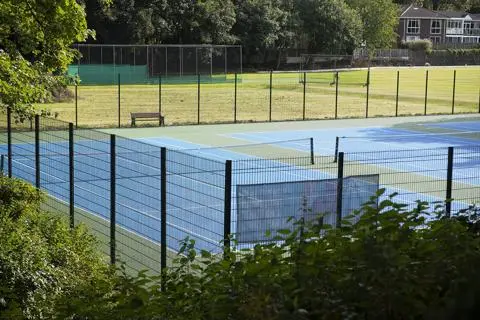 Gated tennis courts at Hamilton Road Park.