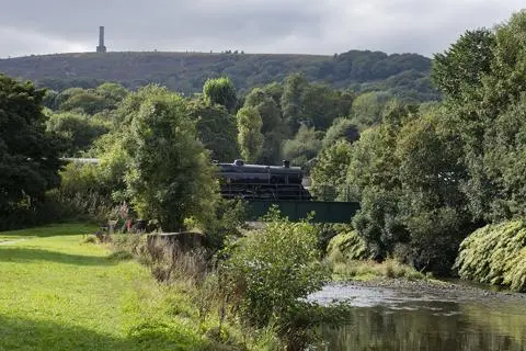 Train on a bridge over a river.